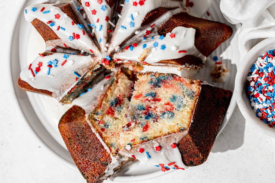 Slices of 4th of July funfetti fluted cake with red, white and blue sprinkles