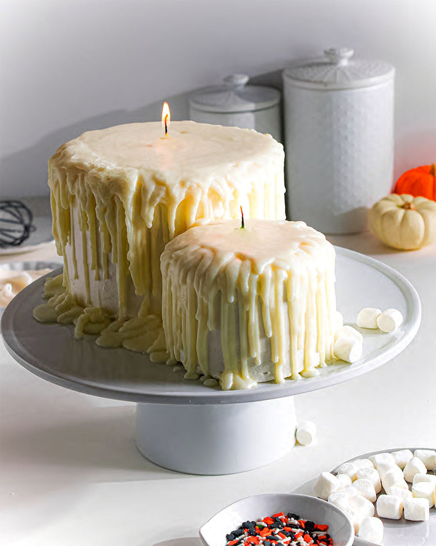 Halloween candle cake with dripping white icing
