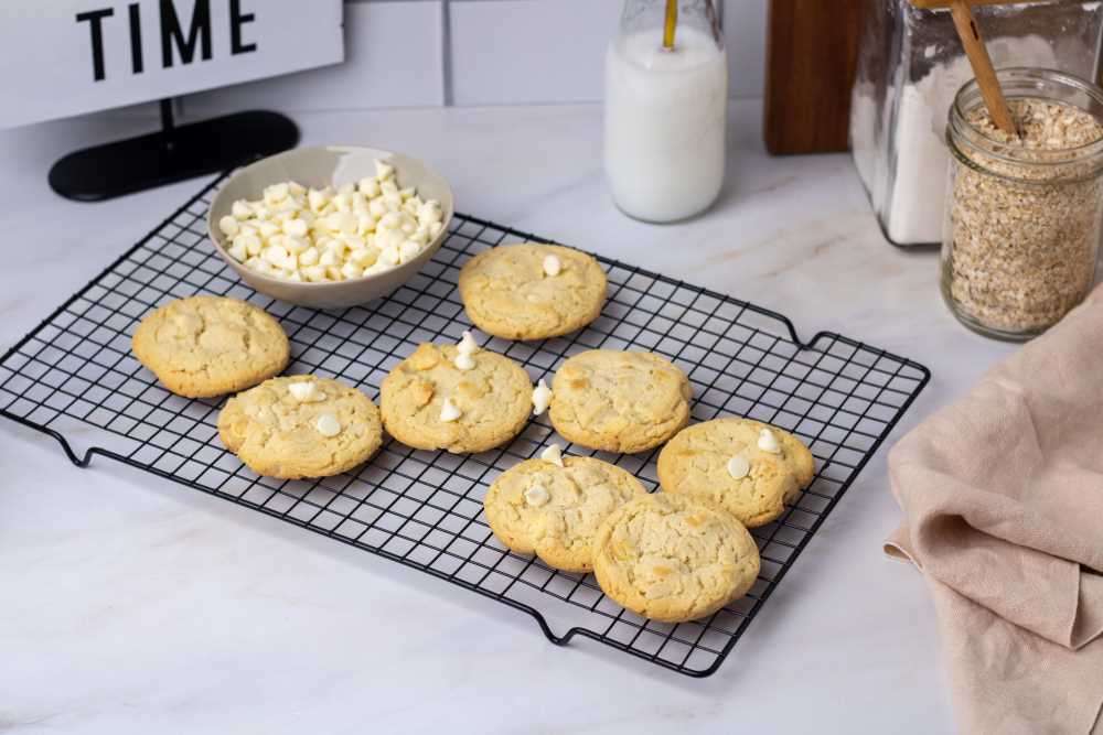 White chocolate macadamia nut cookies on a cooling rack