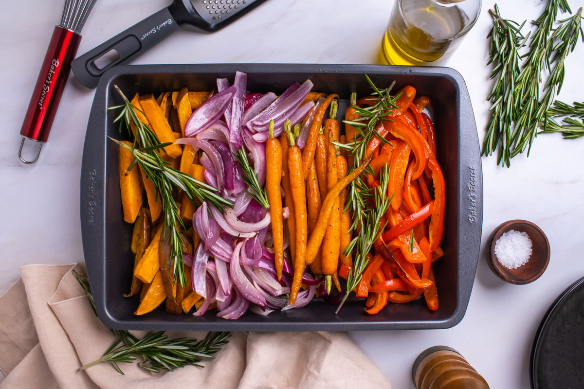 Rainbow roasted vegetables in a non-stick roaster pan