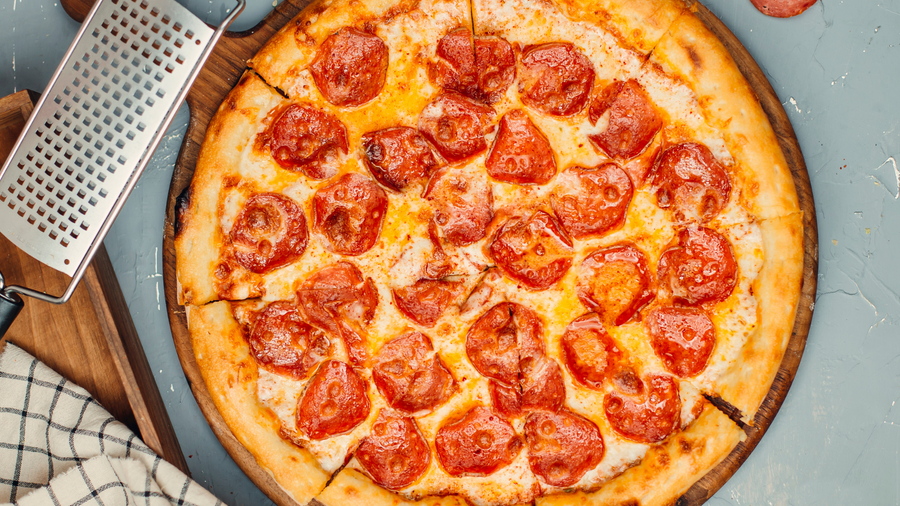 Pepperoni pizza on a perforated Baker's Secret pizza crisper
