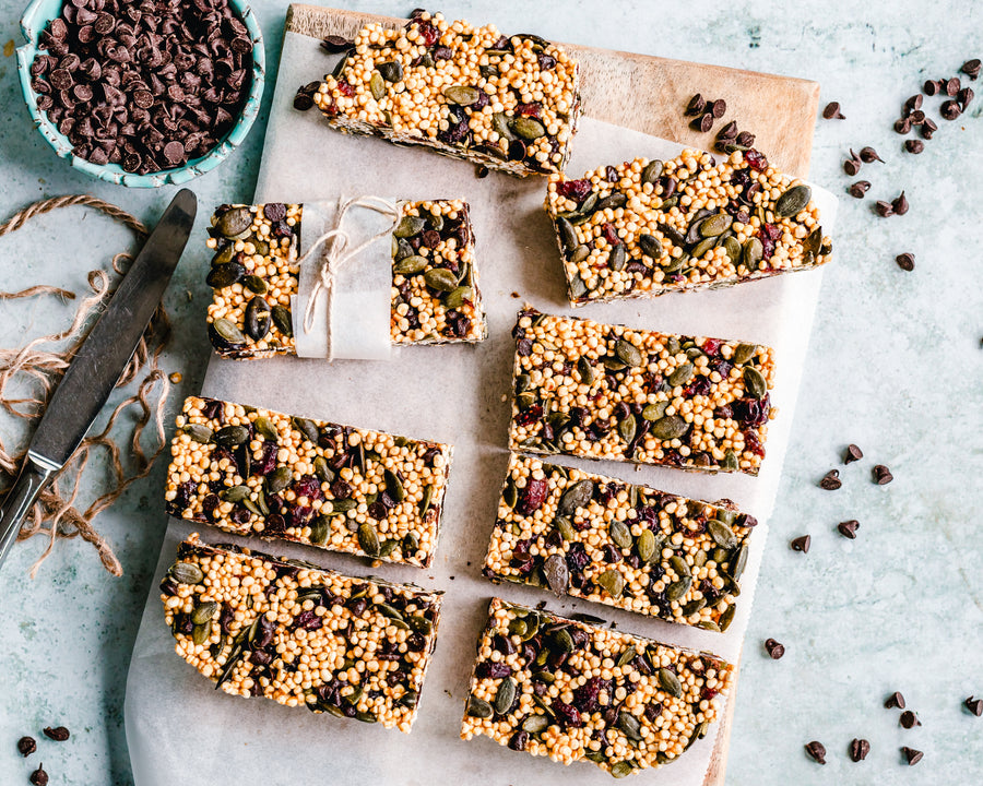 Homemade snack bars cut into squares on parchment