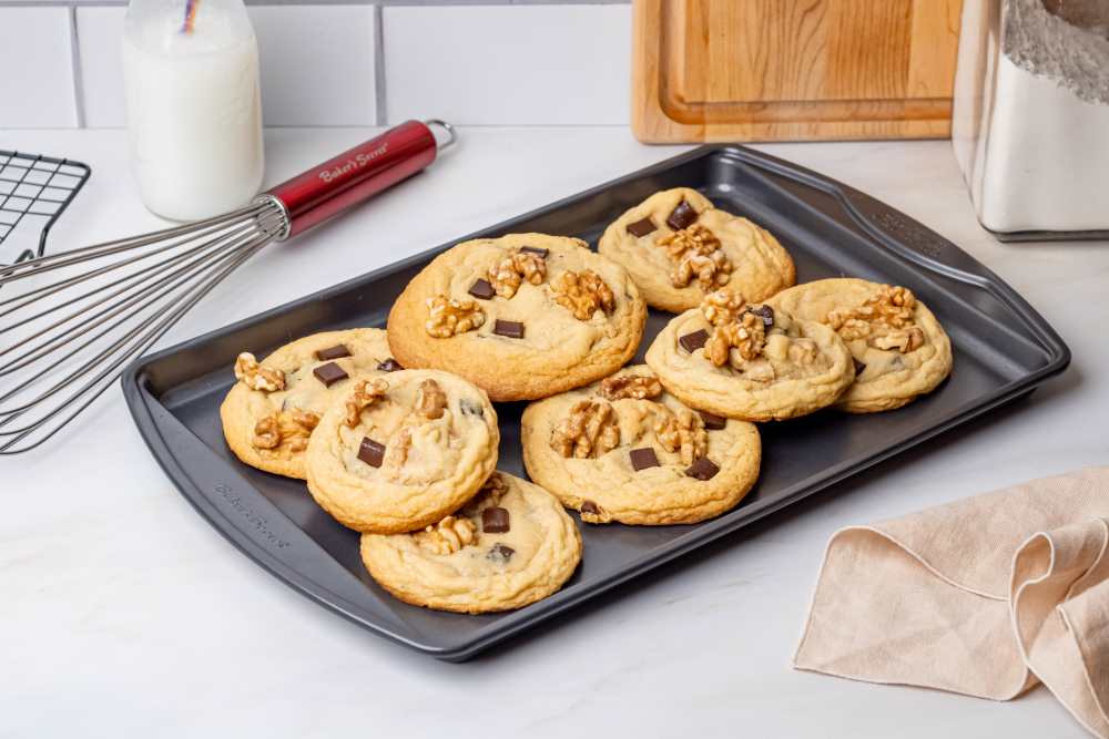 Walnut chocolate chip cookies on a cookie sheet