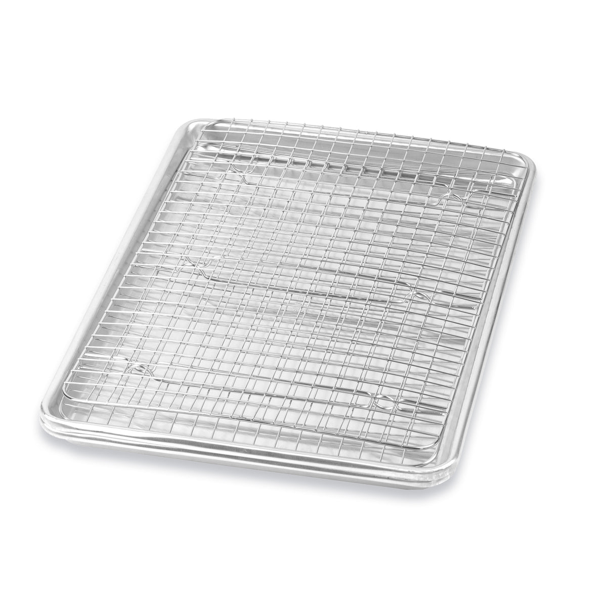 Stainless steel cooling rack sitting inside an aluminum cookie sheet