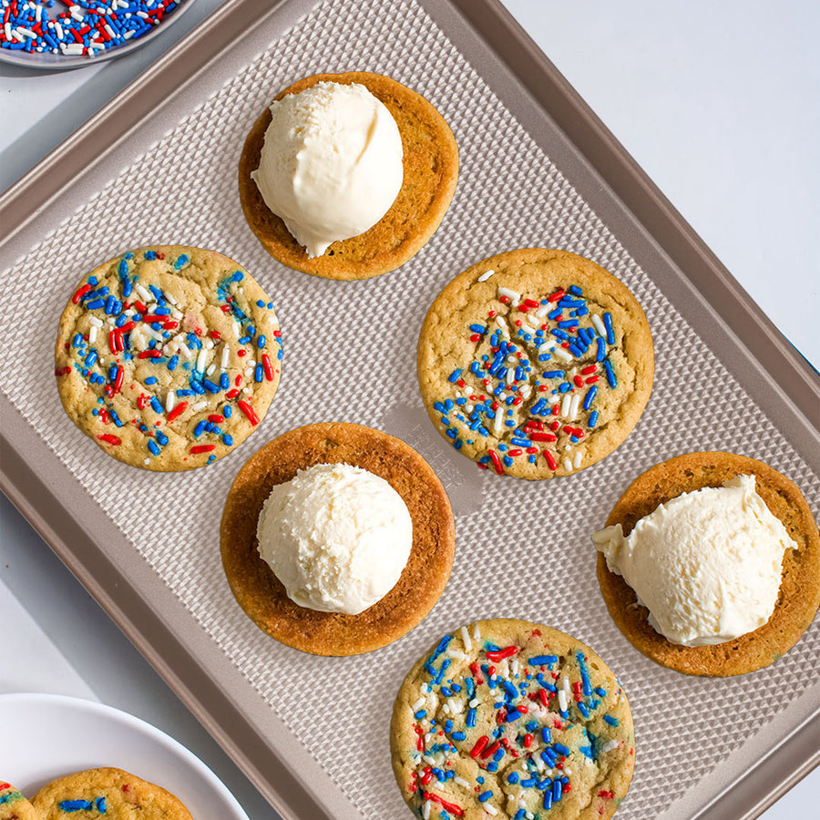 Sprinkle cookies and ice cream scoops on a gold diamond-texture cookie sheet