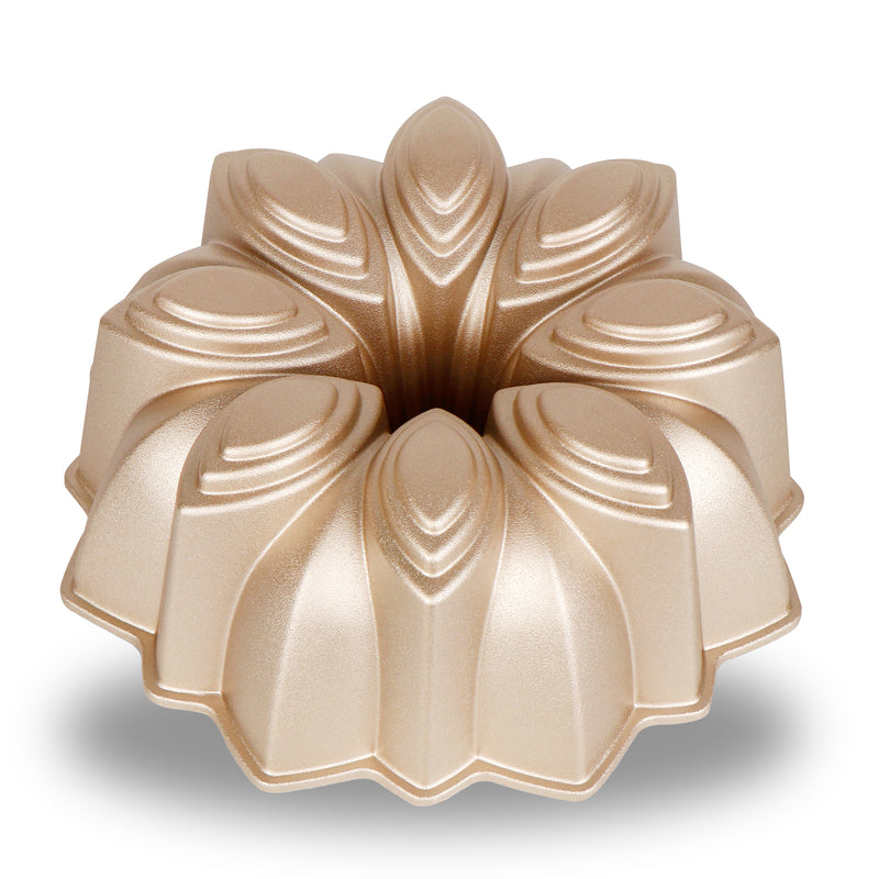 Bloom cast aluminum fluted tube pan with a flower-petal design, champagne gold