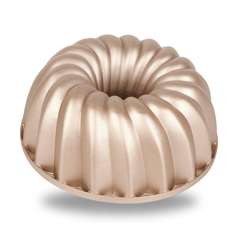 Classic cast aluminum fluted tube pan with a swirl design, champagne gold