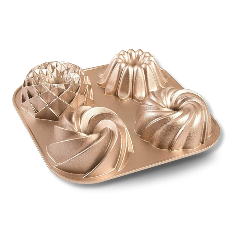 Mini Loves 4-cavity mini fluted cake pan in champagne-gold cast aluminum
