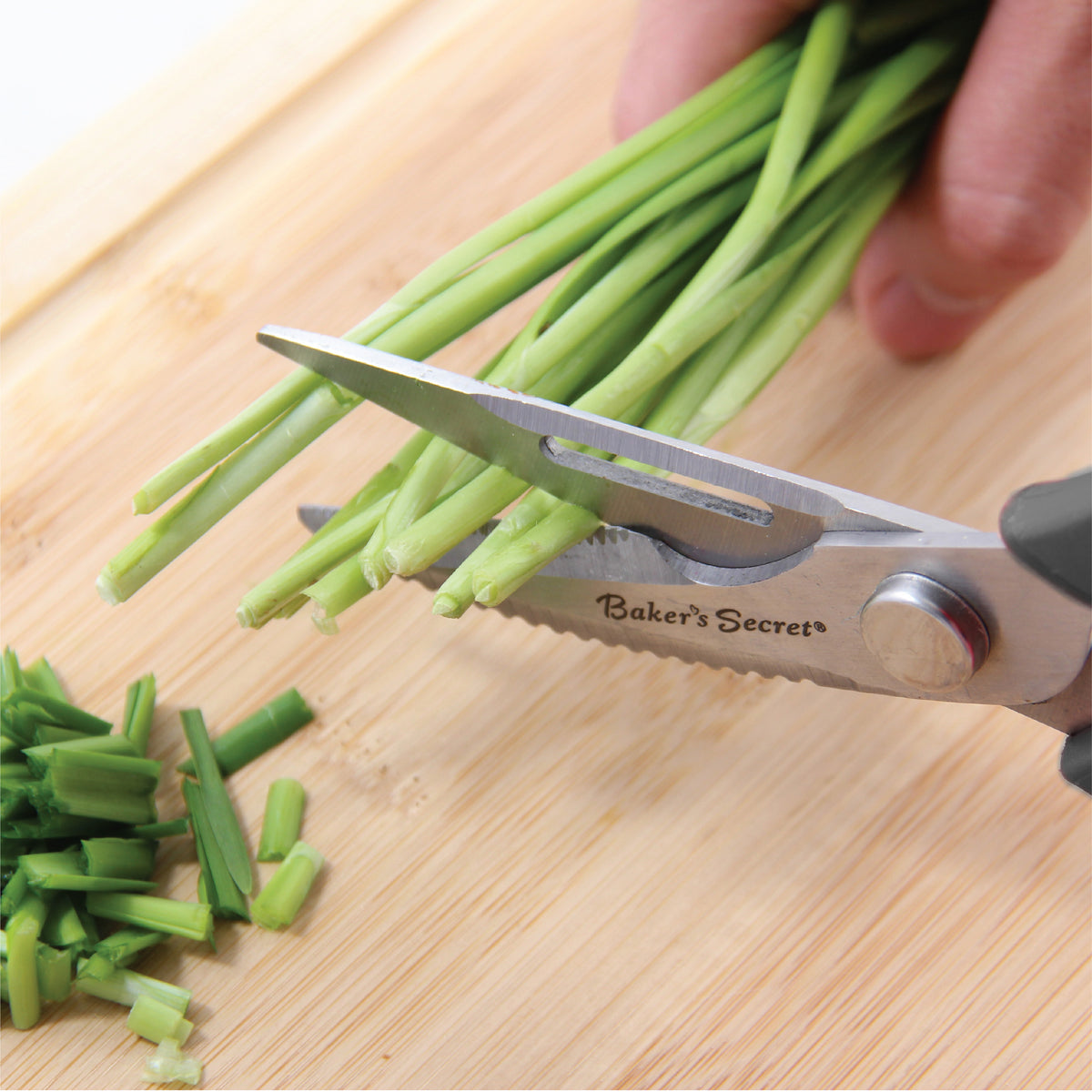 Snipping green onions with the stainless steel kitchen scissors